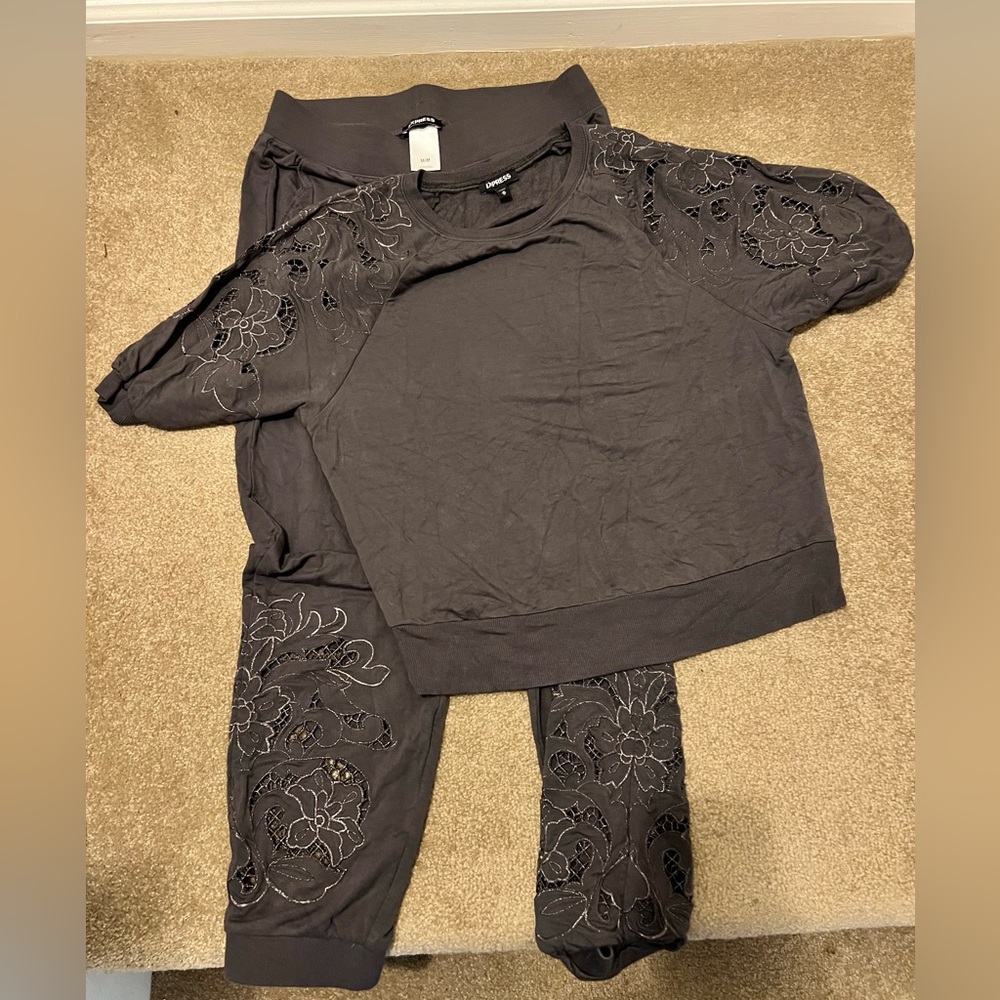 Grey express lounge outfit with cutout details. Soft, stylish outfit.
